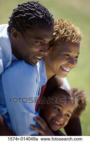 Side profile of parents and their daughter smiling View Large Photo Image Stock Image - Side profile of parents and their daughter smiling. Fotosearch