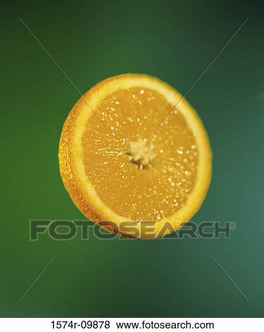Slice of an orange View Large Photo Image Stock Photo - Slice of an orange. Fotosearch