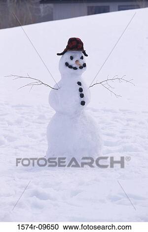 Snowman on a hill View Large Photo Image Stock Image - Snowman on a hill. Fotosearch