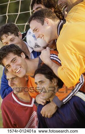 Stock Image - Soccer players smiling. Fotosearch