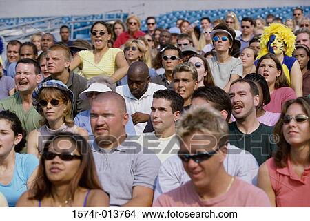 Spectators sitting in a stadium View Large Photo Image Picture - Spectators sitting in a stadium. Fotosearch