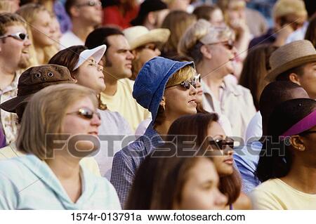 Spectators sitting in a stadium watching with anticipation View Large Photo Image Stock Image - Spectators sitting in a stadium watching with anticipation. Fotosearch