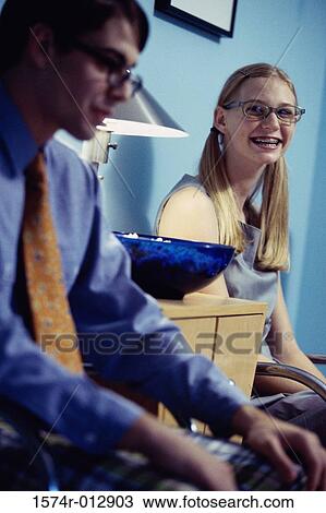 Teenage boy and a teenage girl waiting in a waiting room View Large Photo Image Stock Image - Teenage boy and a teenage girl waiting in a waiting room. Fotosearch