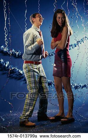 Teenage boy dancing in front of teenage girl at a party View Large Photo Image Stock Image - Teenage boy dancing in front of teenage girl at a party. Fotosearch