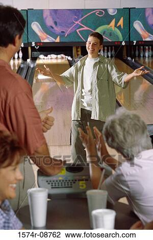 Teenage boy in a bowling alley View Large Photo Image Stock Image - Teenage boy in a bowling alley. Fotosearch