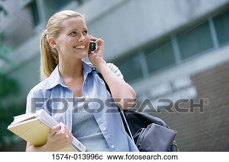 Stock Image - Teenage girl talking on a mobile phone. Fotosearch