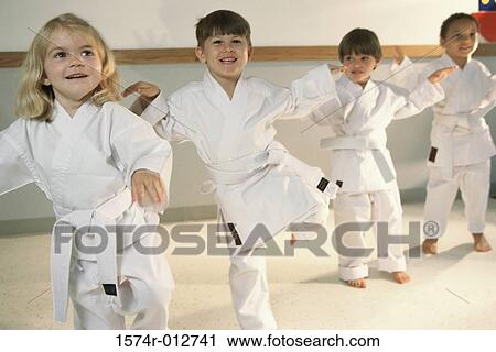 Three boys and a girl learning martial arts View Large Photo Image Stock Image - Three boys and a girl learning martial arts. Fotosearch