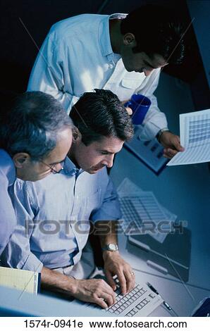 Three businessmen in a meeting View Large Photo Image Stock Image - Three businessmen in a meeting. Fotosearch