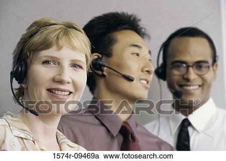 Three customer service representatives wearing headsets smiling View Large Photo Image Stock Image - Three customer service representatives wearing headsets smiling. Fotosearch