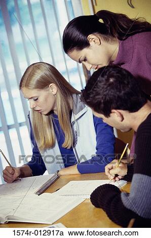 Stock Image - Three high school students studying together. Fotosearch