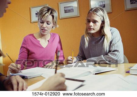 Stock Image - Three high school students studying together. Fotosearch