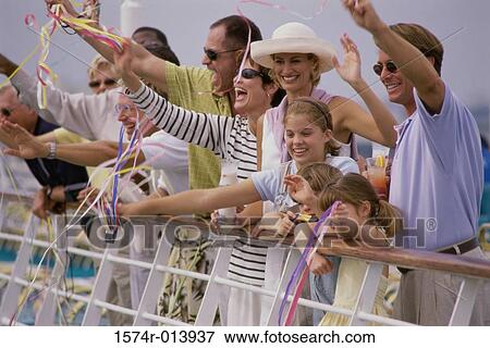 Tourists waving on the deck of a cruise ship View Large Photo Image Stock Photo - Tourists waving on the deck of a cruise ship. Fotosearch