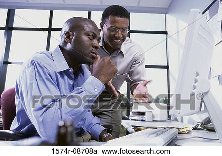 Two businessmen in an office View Large Photo Image Stock Image - Two businessmen in an office. Fotosearch