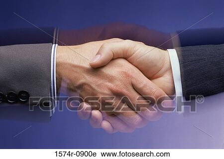 Stock Image - Two businessmen shaking hands. Fotosearch