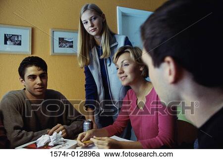 Two teenage boys and two teenage girls in a discussion View Large Photo Image Stock Image - Two teenage boys and two teenage girls in a discussion. Fotosearch