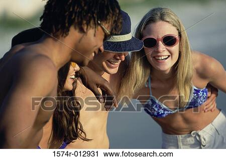Two teenage couples smiling View Large Photo Image Stock Image - Two teenage couples smiling. Fotosearch