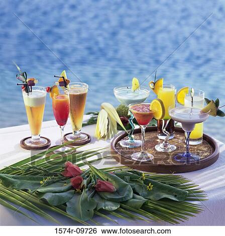 Variety of cocktails on a table View Large Photo Image Stock Photograph - Variety of cocktails on a table. Fotosearch
