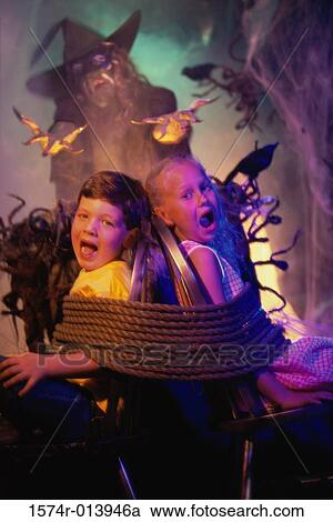Witch spreading her hands toward two captured children View Large Photo Image Stock Image - Witch spreading her hands toward two captured children. Fotosearch