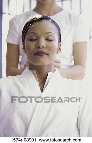 Woman getting a neck massage View Large Photo Image Stock Image - Woman getting a neck massage. Fotosearch
