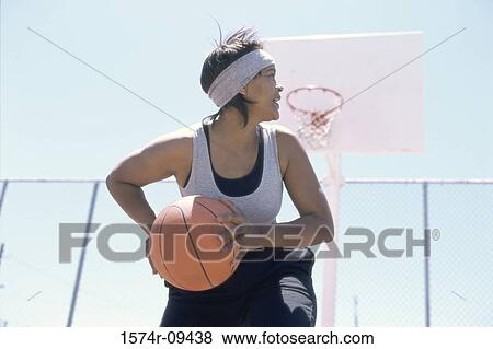 Woman playing basketball View Large Photo Image Stock Photo - Woman playing basketball. Fotosearch