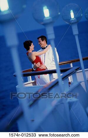 Young couple dancing on the deck of a cruise ship View Large Photo Image Stock Image - Young couple dancing on the deck of a cruise ship. Fotosearch