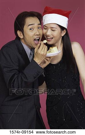 Young couple eating cake View Large Photo Image Picture - Young couple eating cake. Fotosearch