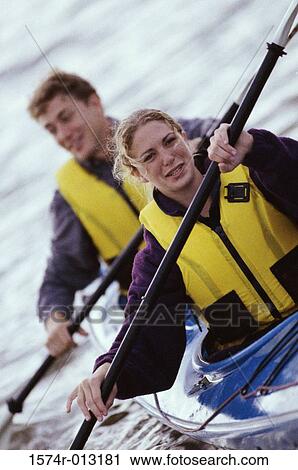 Young couple kayaking View Large Photo Image Stock Image - Young couple kayaking. Fotosearch