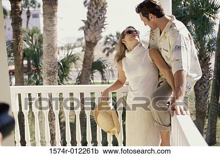 Stock Image - Young couple looking at each other. Fotosearch