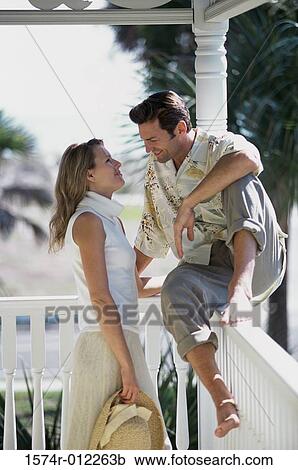 Young couple looking at each other View Large Photo Image Stock Image - Young couple looking at each other. Fotosearch