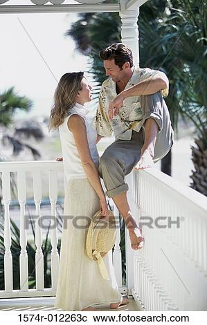 Young couple looking at each other View Large Photo Image Stock Image - Young couple looking at each other. Fotosearch