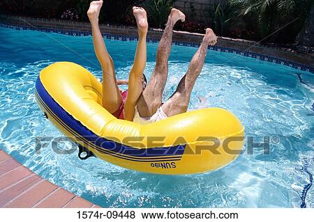 Young couple lying on an inflatable raft View Large Photo Image Stock Photo - Young couple lying on an inflatable raft. Fotosearch