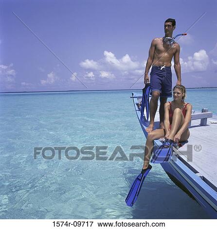 Young couple on a boat View Large Photo Image Stock Photo - Young couple on a boat. Fotosearch