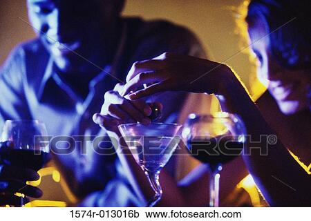 Young couple sitting in a bar View Large Photo Image Stock Image - Young couple sitting in a bar. Fotosearch