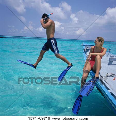 Stock Photograph - Young couple snorkeling. Fotosearch