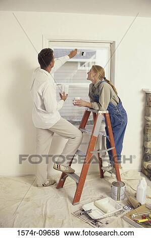 Young couple standing on a ladder View Large Photo Image Stock Photo - Young couple standing on a ladder. Fotosearch