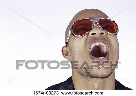 Young man looking up with his mouth wide open View Large Photo Image Stock Image - Young man looking up with his mouth wide open. Fotosearch