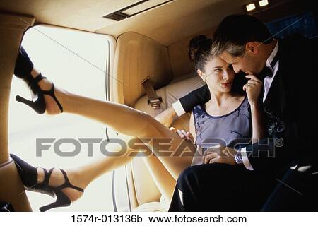 Young woman flirting with a young man in an airplane View Large Photo Image Stock Image - Young woman flirting with a young man in an airplane. Fotosearch