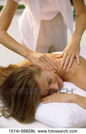 Young woman getting a back massage View Large Photo Image Stock Image - Young woman getting a back massage. Fotosearch