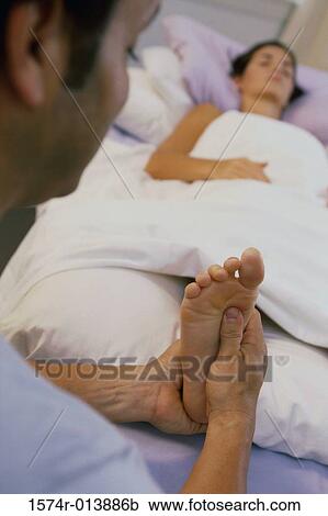 Young woman getting a foot massage View Large Photo Image Stock Image - Young woman getting a foot massage. Fotosearch