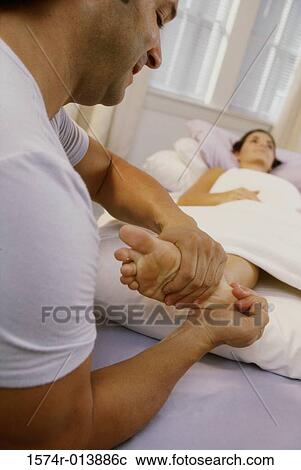 Young woman getting a foot massage View Large Photo Image Stock Image - Young woman getting a foot massage. Fotosearch