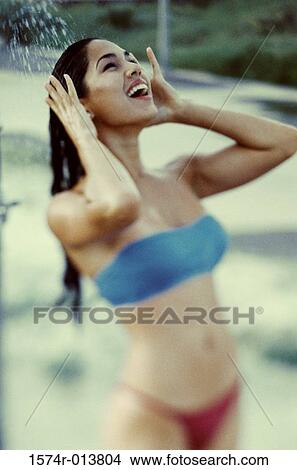 Young woman taking a shower View Large Photo Image Picture - Young woman taking a shower. Fotosearch
