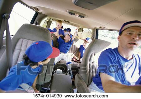 Baseball players sitting with their coach in a van View Large Photo Image Stock Image - Baseball players sitting with their coach in a van. Fotosearch