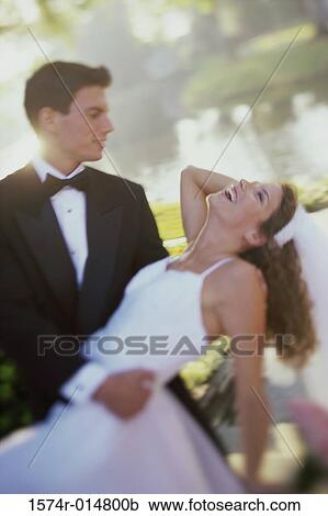 Bride and groom looking at each other View Large Photo Image Stock Image - Bride and groom looking at each other. Fotosearch