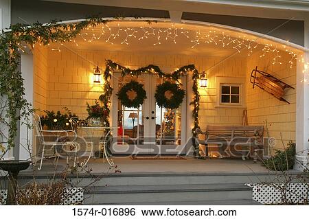 Stock Photograph - Christmas decoration around an entrance door. Fotosearch