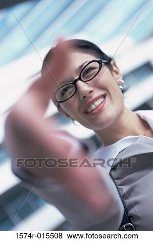 Close-up of a businesswoman holding out her hand View Large Photo Image Stock Photo - Close-up of a businesswoman holding out her hand. Fotosearch