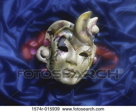 Close-up of a face mask on blue fabric View Large Photo Image Stock Photo - Close-up of a face mask on blue fabric. Fotosearch