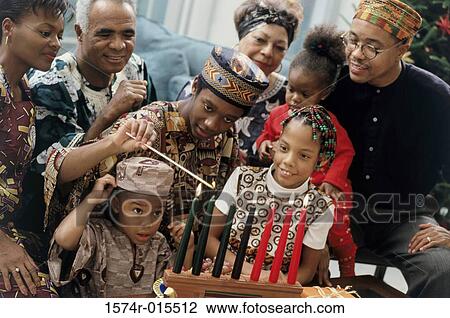 Stock Image - Close-up of a family celebrating Kwanzaa. Fotosearch