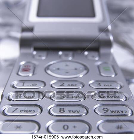 Close-up of a flip mobile phone View Large Photo Image Stock Photography - Close-up of a flip mobile phone. Fotosearch