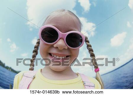 Close-up of a girl smiling View Large Photo Image Stock Image - Close-up of a girl smiling. Fotosearch