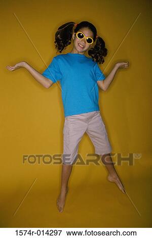 Close-up of a girl smiling View Large Photo Image Stock Photo - Close-up of a girl smiling. Fotosearch